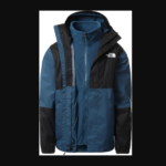 The North Face blue and black colour-blocked jacket with high collar and fleece lining—stylish warmth for outdoor layering