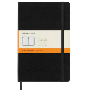 A black hard‑cover Moleskine Classic large ruled notebook measuring 5 by 8.25 inches.