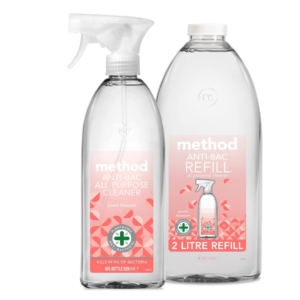A Method Peach Blossom antibacterial spray (828 ml) with a 2 L refill bottle in matching packaging.
